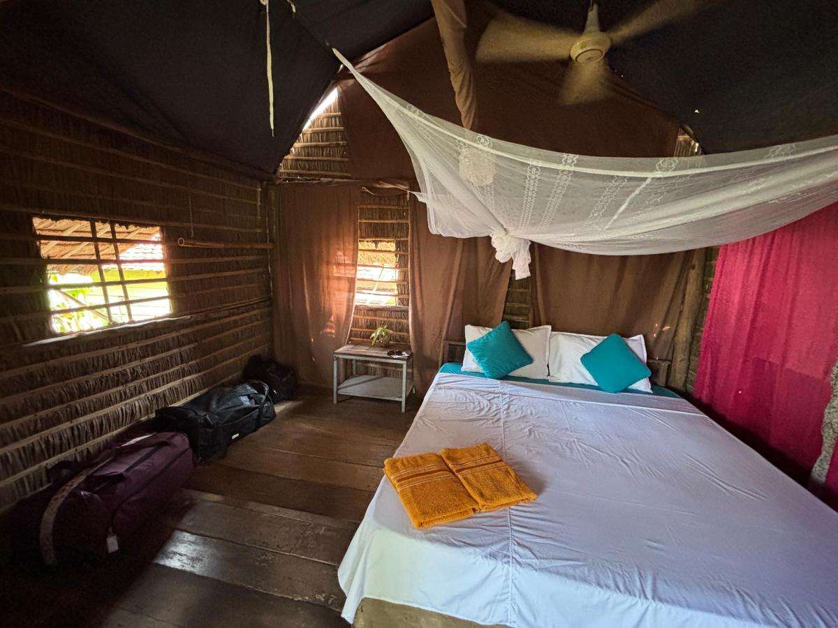 One-Bedroom Apartment bedroom with mosquito net